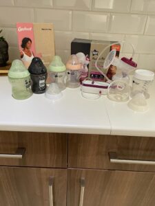 Tommee Tippe Breast Pump, 5 bottles and Cariwell Bellybinder